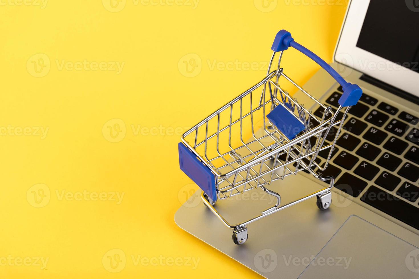 Empty mini shopping trolley, Shopping cart, on a yellow background. RFI Request for information. copy space photo