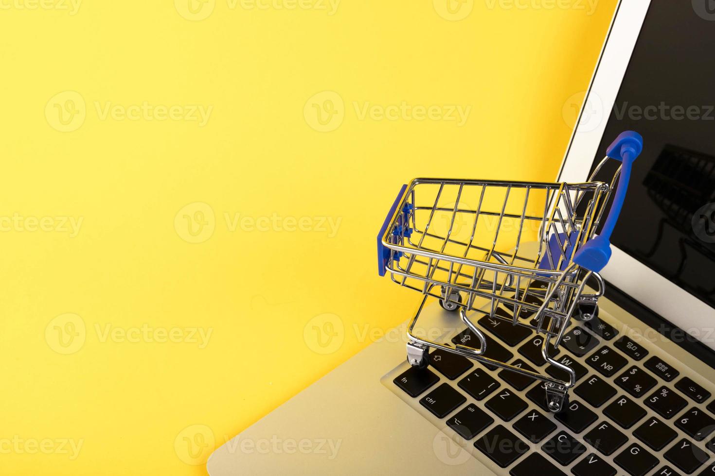 Empty mini shopping trolley, Shopping cart, on a yellow background. RFI Request for information. copy space photo