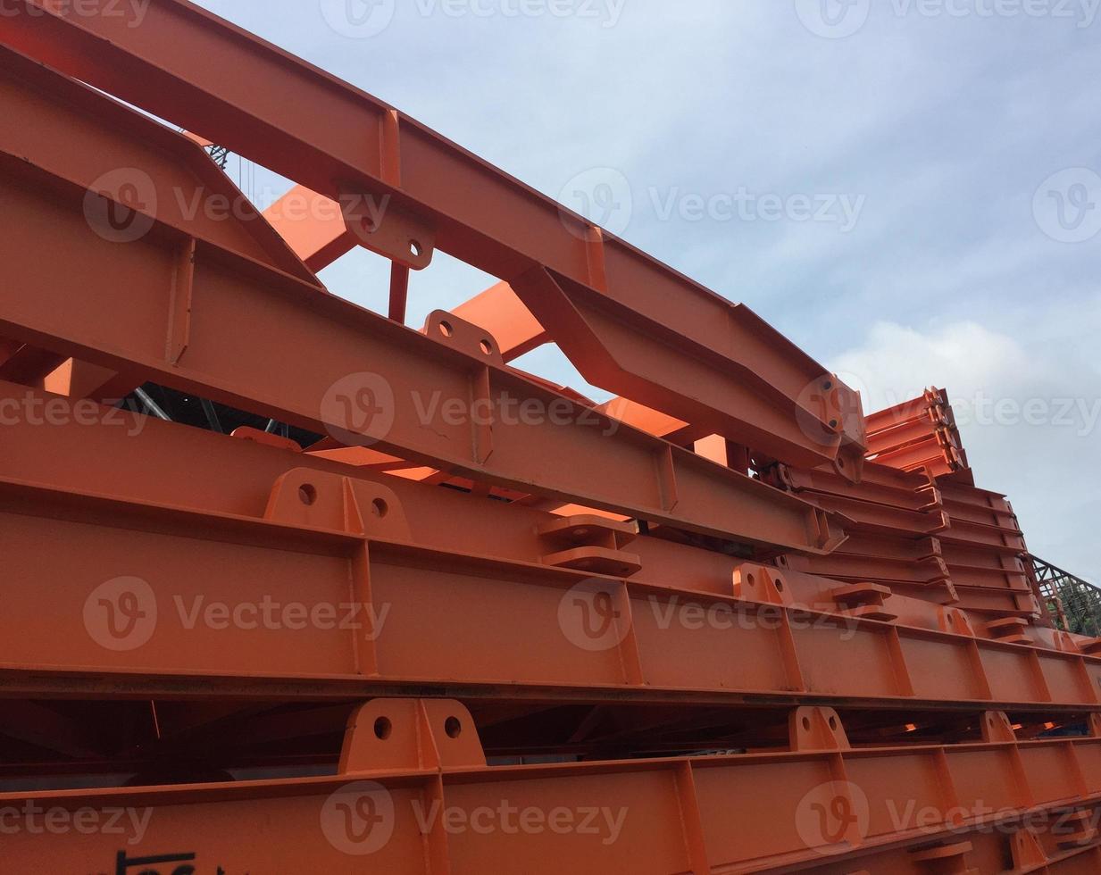 A pile of high-strength steel material in orange color. T photo