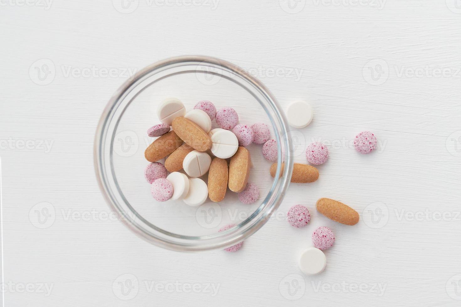 Medical various pills on light background. Close up top view. photo