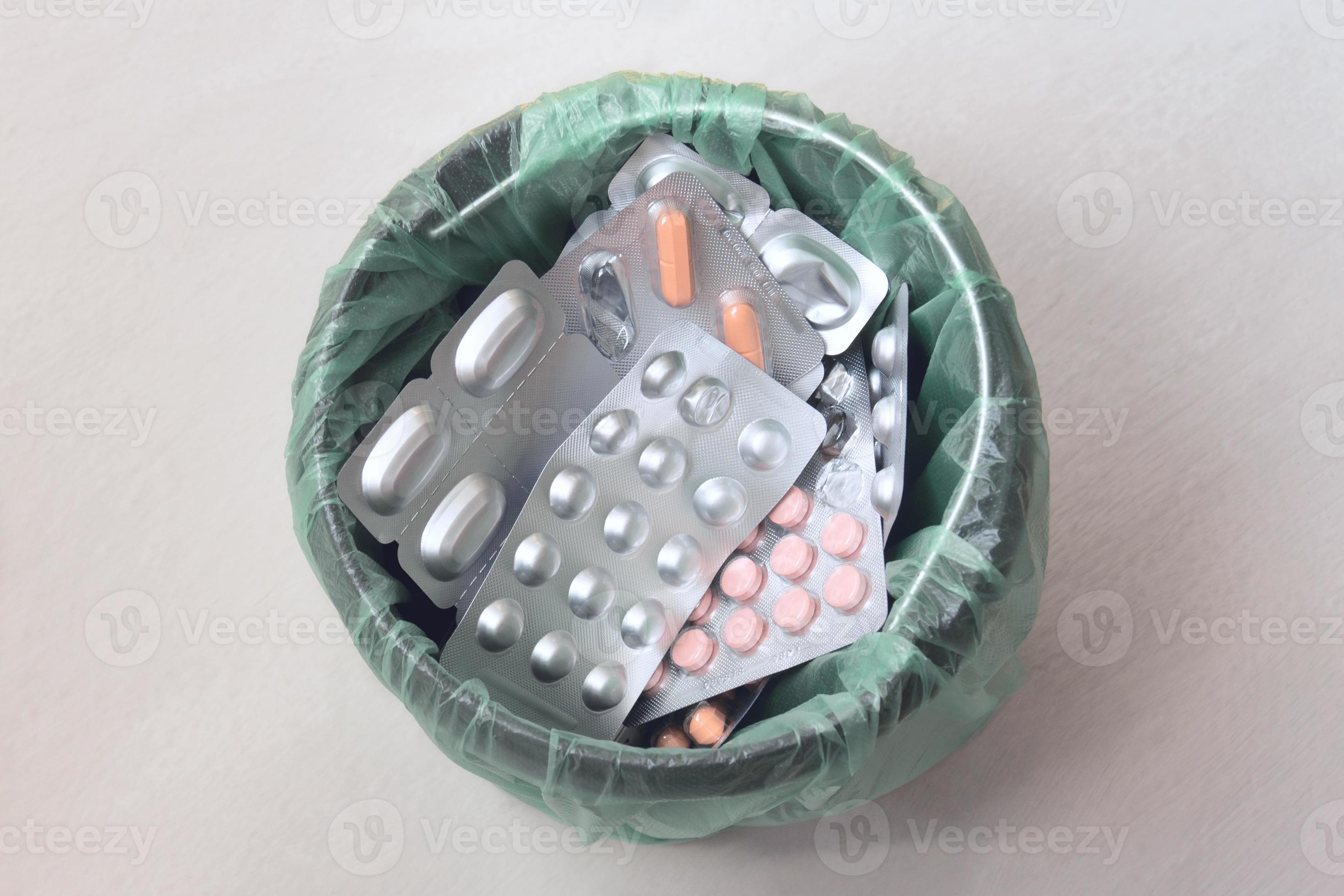 Trash bin with medical pills. Waste of different packages of medicines