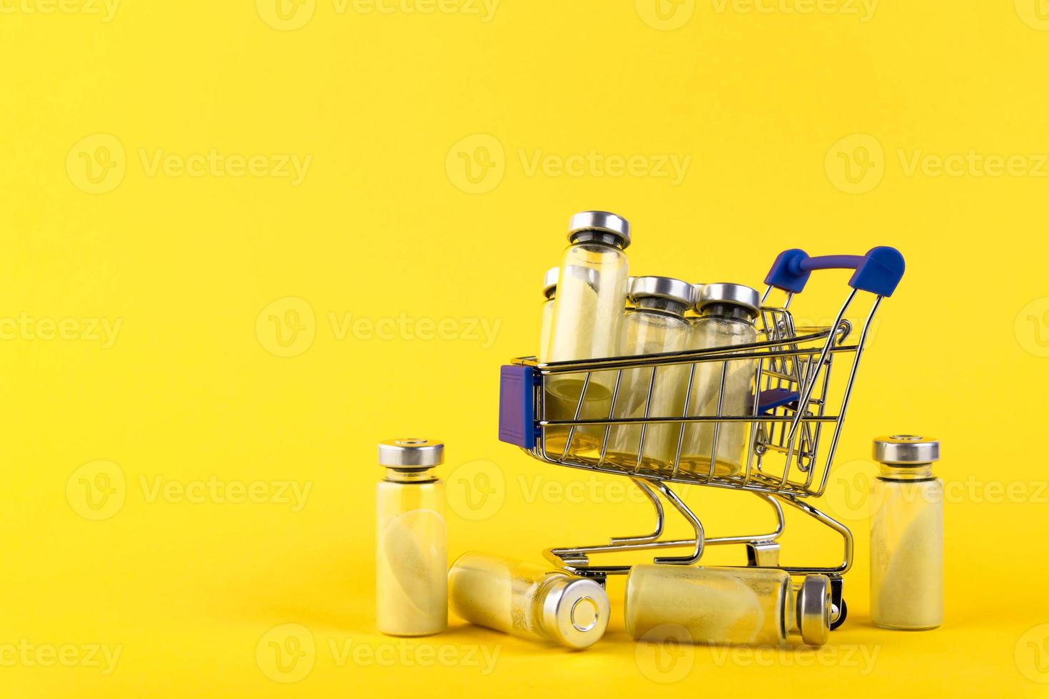 Bubbles, ampoules with dry probiotic, bifidobacteria, on a yellow background. Copy space. photo