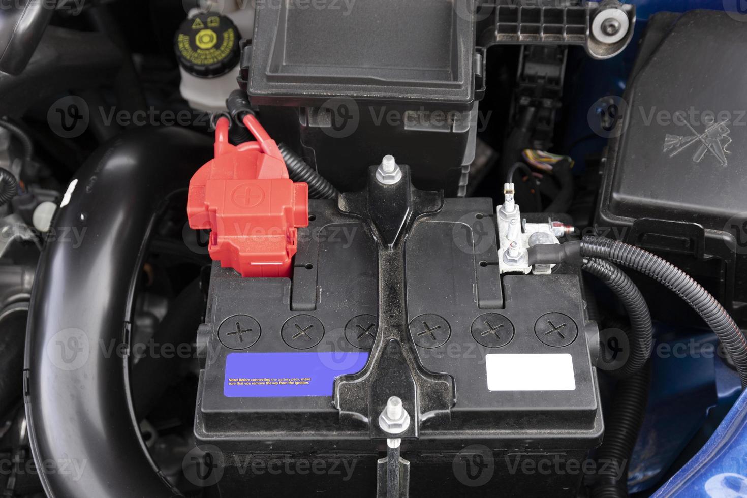 Car with open hood.Battery. Details of new car engine. photo