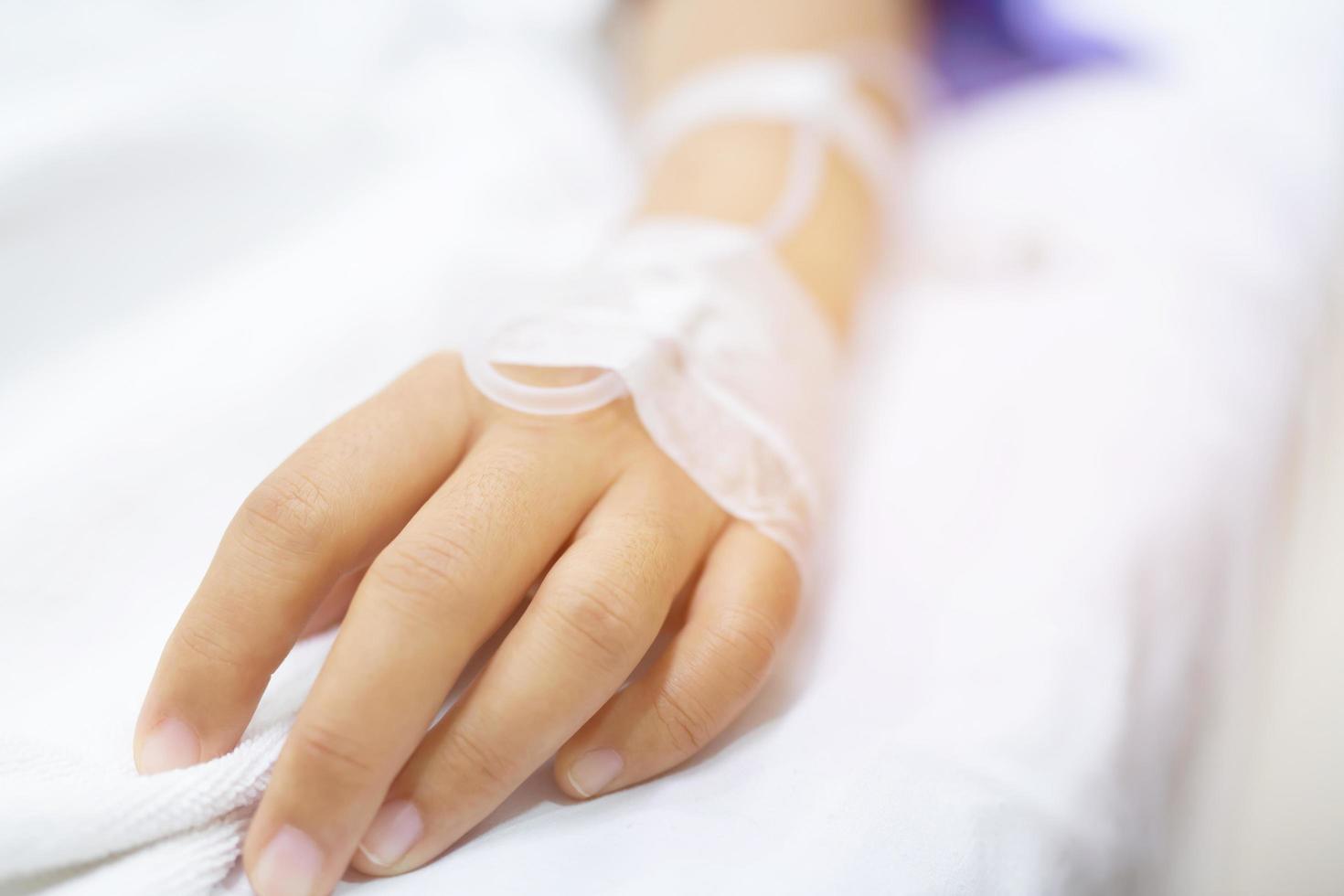 In the Hospital Sick Male Patient Sleeps on the Bed. Heart Rate Monitor