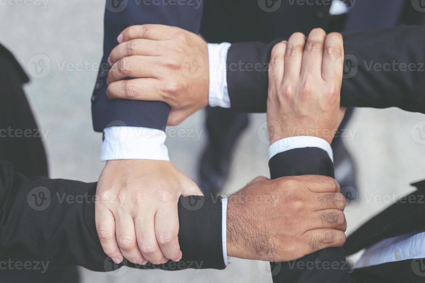 Close up of Group people of businessmen joining photo