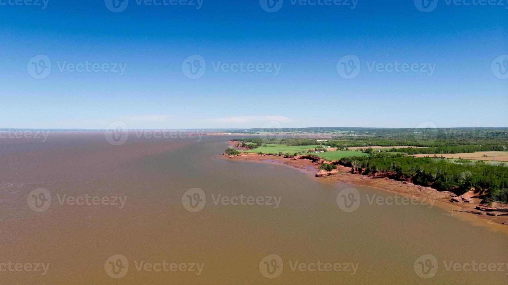 The Bay of Fundy with Sea Bed visible near Burnt Coat Head,Nova Scotia photo