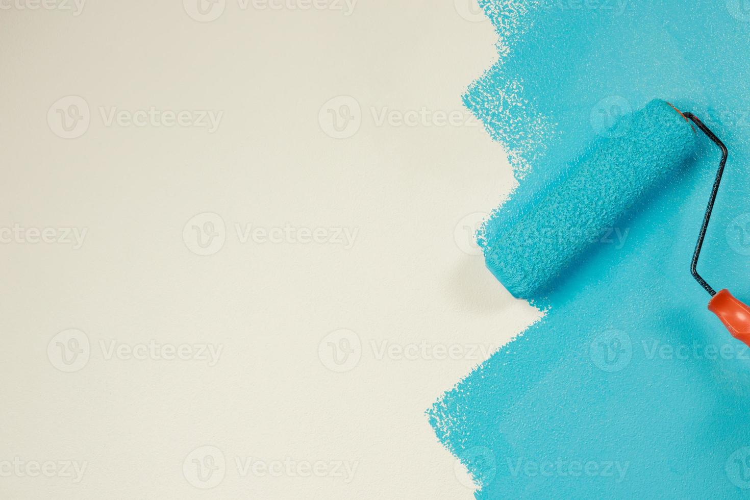 Painter is painting the interior wall Blue photo
