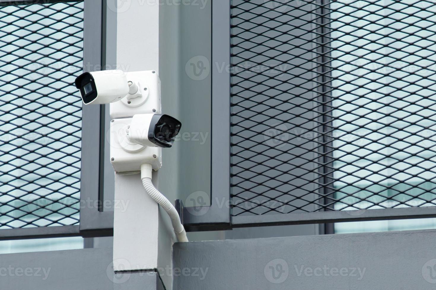 close up Multi-angle CCTV camera are installed in the green park public, concept CCTV camera operating watching city security cover of theft. soft focus. photo