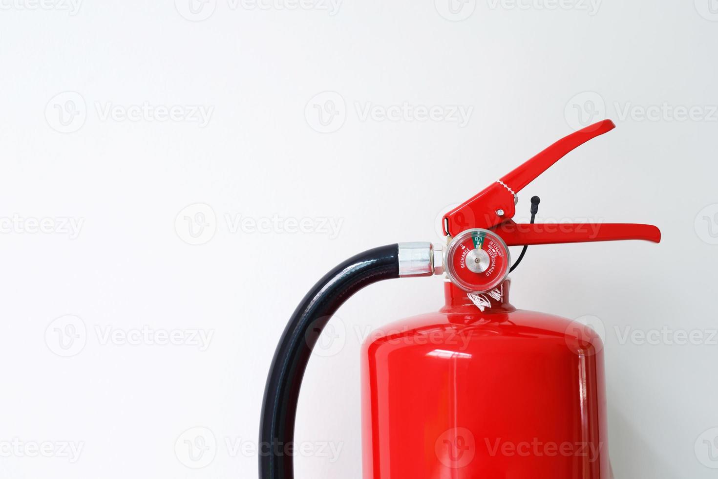 Fire Extinguishers Ready for use in building and industrial safety. photo