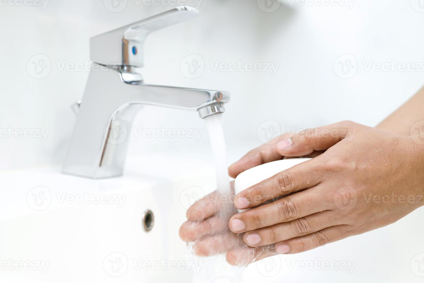 Hygiene. Cleaning Hands. Washing hands with soap under the faucet with