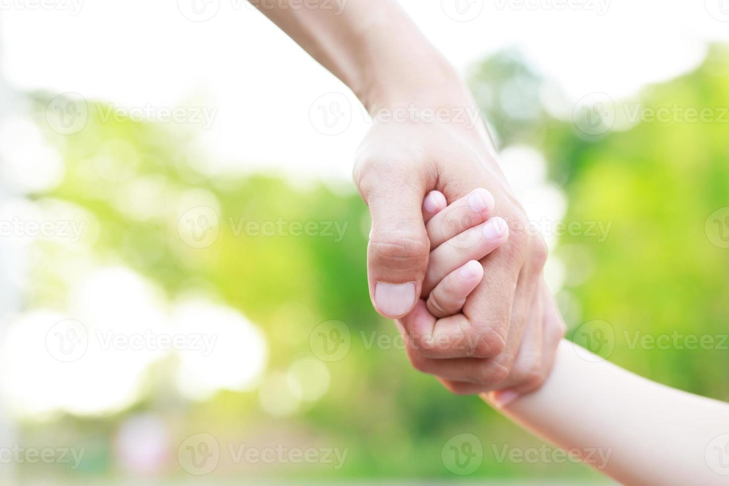 Children's hands with the warmth of mother's care photo