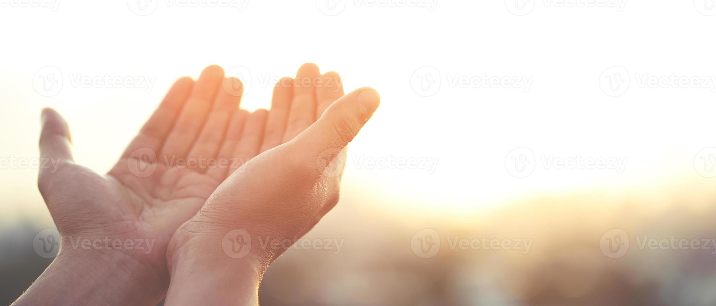 Human hands open palm up worship Praying with faith and belief in God of an appeal to the sky. Concept Religion and spirituality with believe Power of hope or love and devotion. filler tone vintage. photo