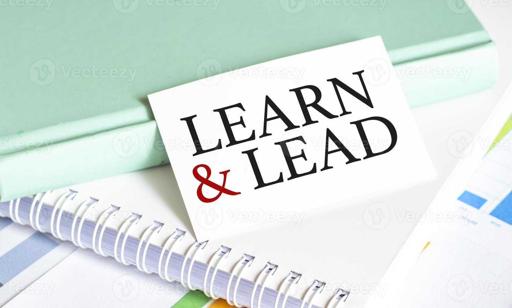 learn and lead words with charts and notepads photo