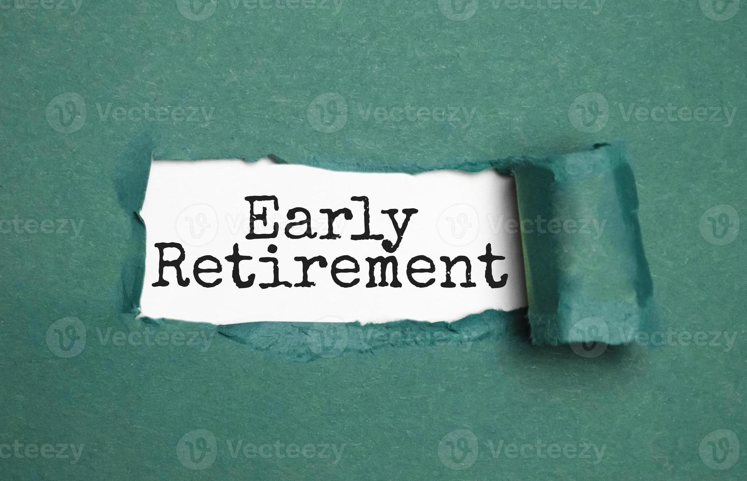 EARLY RETIREMENT text on torn paper , green background photo