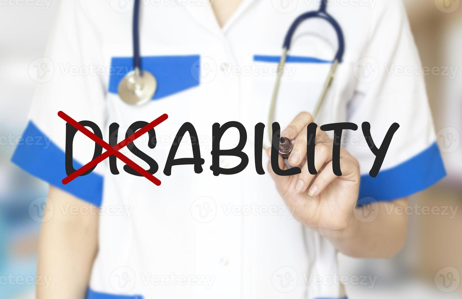 Hand turning the word Disability into Ability with marker photo