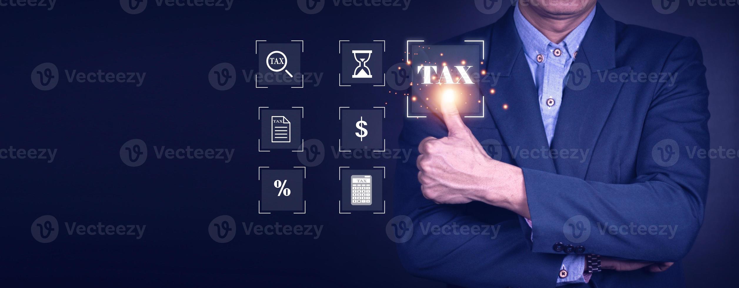 Calculation tax return concept.Business person using a laptop to complete income tax return form online. photo