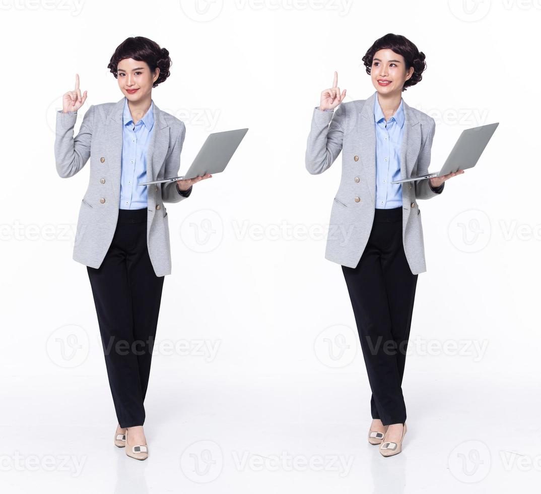 Full length 30s 40s Asian Woman teacher manager business, pointing finger up in Air photo