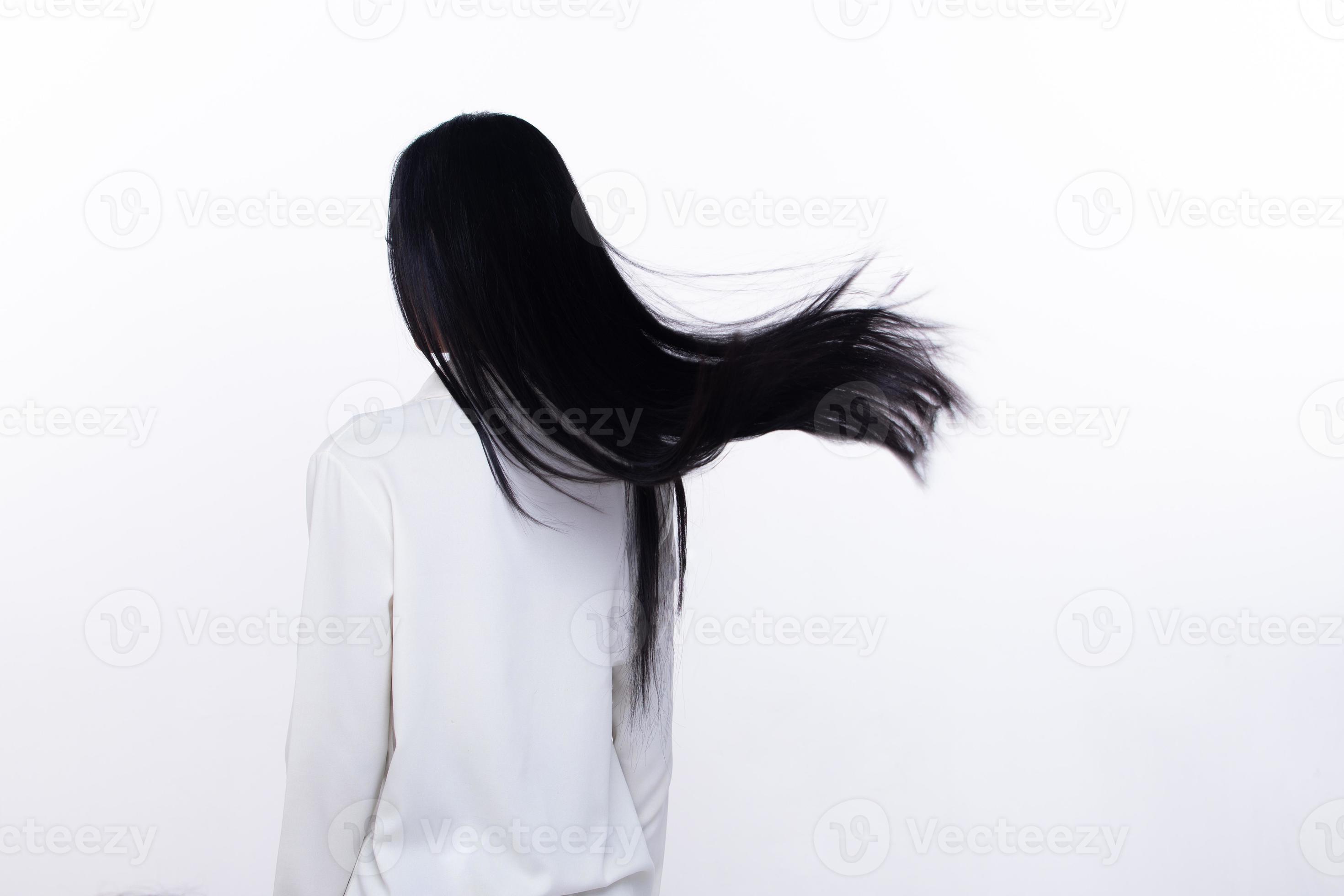 Black Straight Long Black Hair woman throw fly in air with fashion stylish and fun joy. Female turn back wear white shirt express emotion happy by blow wind hair, isolated white background Black Straight Long Black Hair woman throw fly in air with fashion stylish and fun joy. Female turn back wear white shirt express emotion happy by blow wind hair, isolated white background