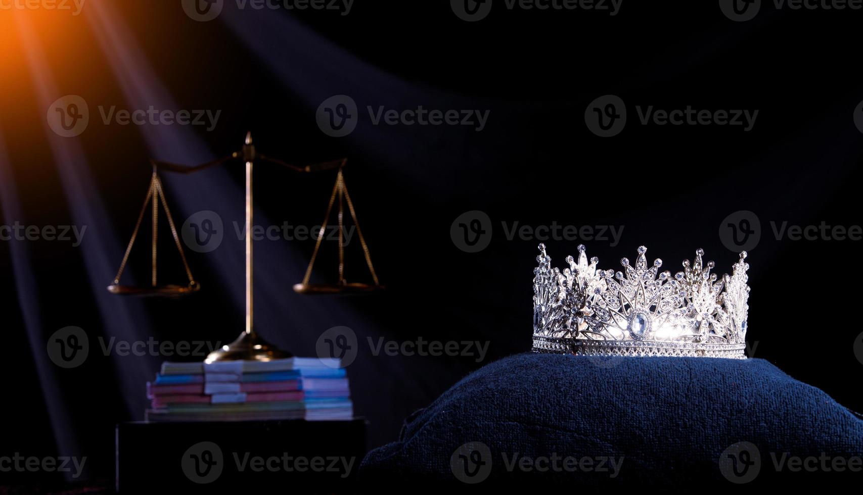 Diamond Crown of Miss Beauty Queen Pageant Contest and Scale Justice Balance are on Black Background as ramp light leak. Concept of Fairness and unfair in Pageant Contest Business, copy space photo