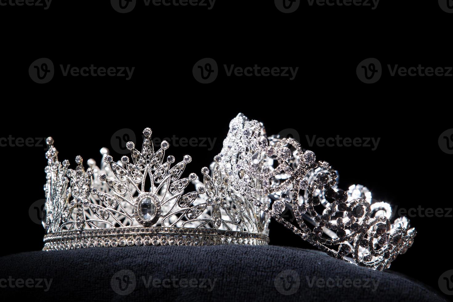 Diamond Silver Crown for Miss Pageant Beauty Contest, Crystal Tiara jewelry decorated gems stone and abstract dark background on black velvet fabric cloth, Macro photography copy space for text logo photo