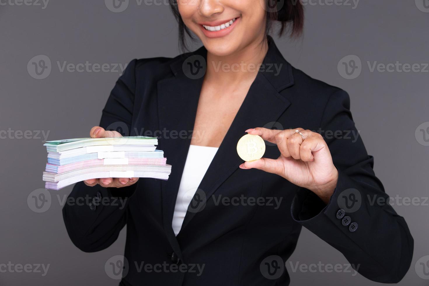 Asian Indian business woman show beautiful smile happy lips, show BTC bitcoin cryptocurrency photo