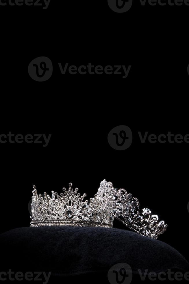 Diamond Silver Crown for Miss Pageant Beauty Contest, Crystal Tiara jewelry decorated gems stone and abstract dark background on black velvet fabric cloth, Macro photography copy space for text logo photo