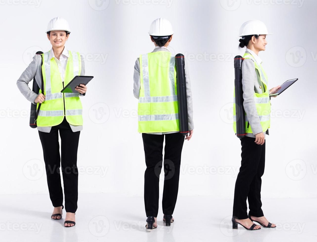 Full length 20s young Mix Race engineer architect client Woman, 360 front side rear back, wear safety vast hardhat tablet. Office female stands feels smile happy over white background isolated photo