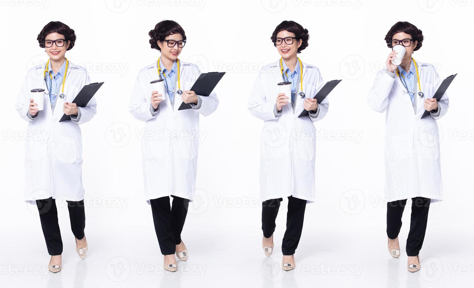 Full length 30s 40s Asian Woman Doctor with stethoscope, walking forward left right, wear formal Coat pant shoes. Smile Hospital female carry Patient Chart coffee cup over white background isolated photo