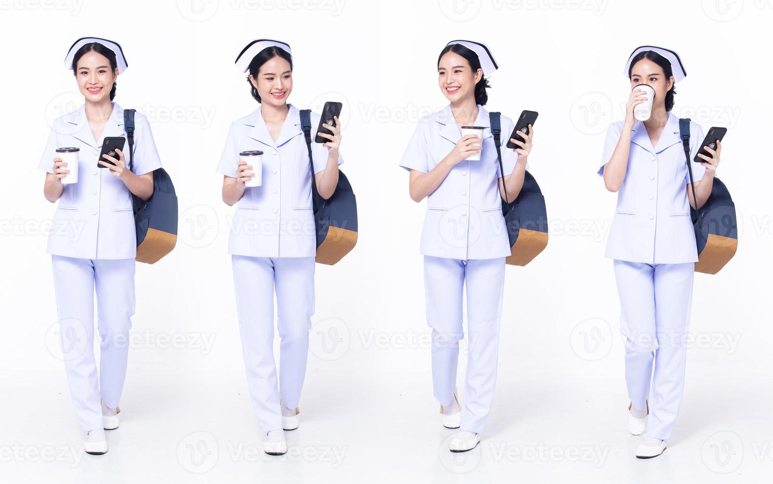 Full length 30s 20s Asian Woman Nurse hospital, walking forward left right, wear formal uniform pant shoe. Smile Hospital female carry backpack coffee cup internet phone over white background isolated photo