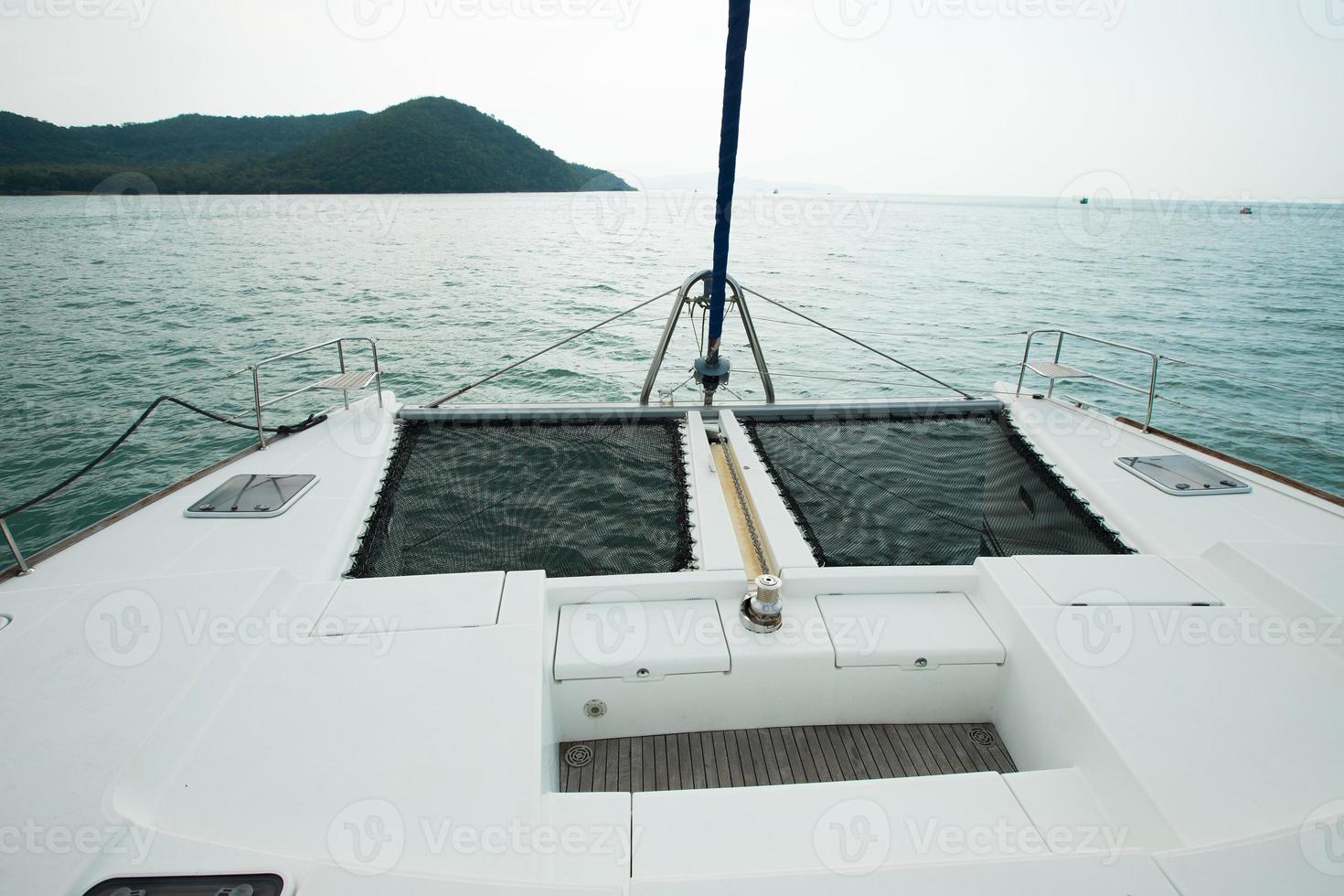 Many Luxury Yachts float on crystal clear sea in Marina Bay Club, expensive Private boat stay calm in docking pier under summer blue sky green ocean photo