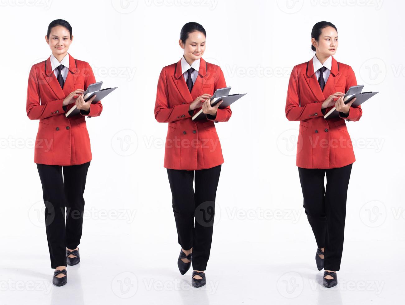 Full length 20s young Mix Race Woman business  financial accountant, walking forward left right, wear formal blazer tie and shoes. Office female stands feels happy smile over white background isolated photo