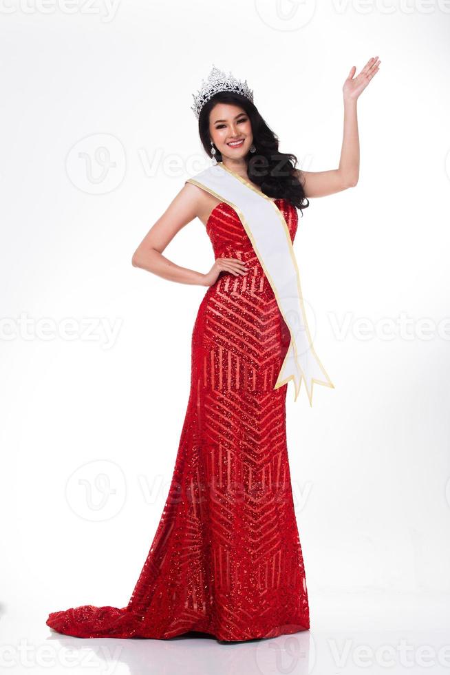 Full Length of Miss Pageant Contest in Asian Red Sequin Evening Ball Gown dress with Silver Diamond Crown Sash, fashion make up face hair style, studio lighting white background isolated copy space photo