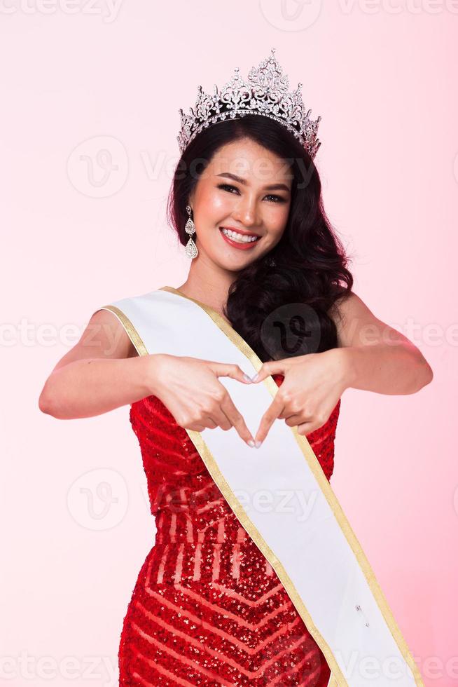 Full Length of Miss Pageant Contest in Asian Red Sequin Evening Ball Gown dress with Silver Diamond Crown Sash, fashion make up face hair style, studio lighting white background isolated copy space photo
