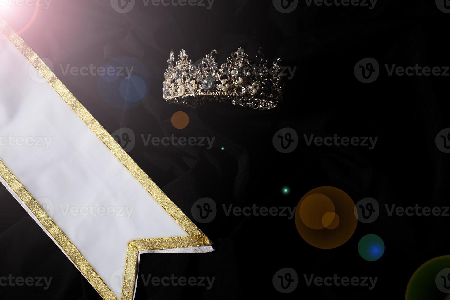 White Gold Winner Sash for Miss Pageant Beauty Contest, empty area for text winner country word, studio lighting abstract dark drapping textile background, Importance Decoration with Diamond Crown photo