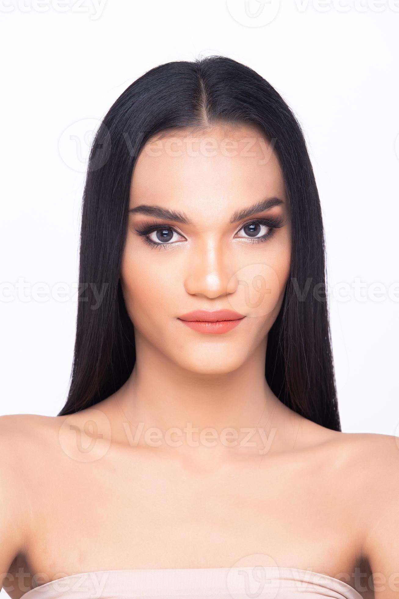 Beautiful fresh skin woman open shoulder with clean look make up and long  black hair. Portrait young girl in attractive natural fashion face express  feel smile, show eye lip, isolated white background