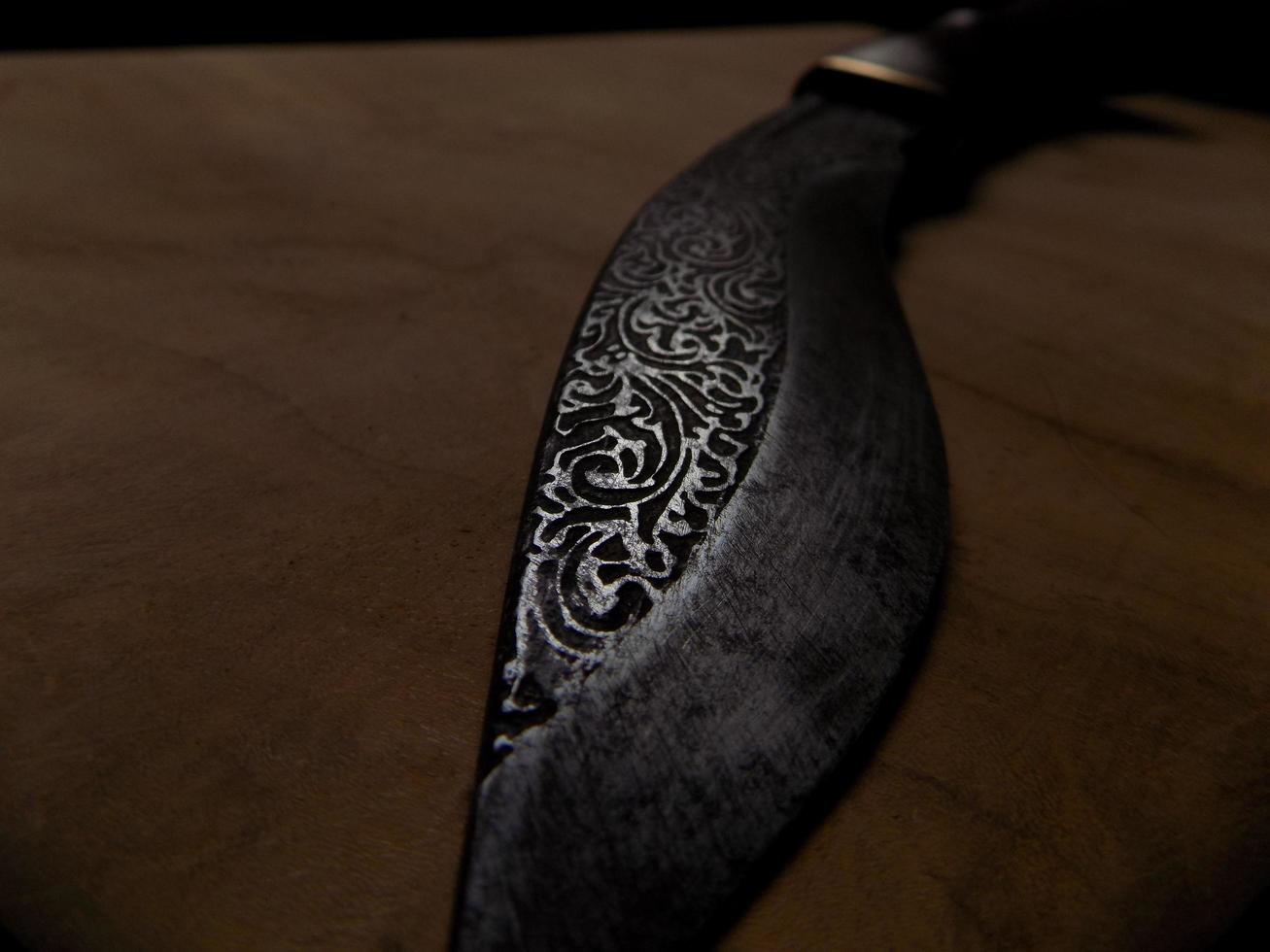 a knife with an iron engraving photo