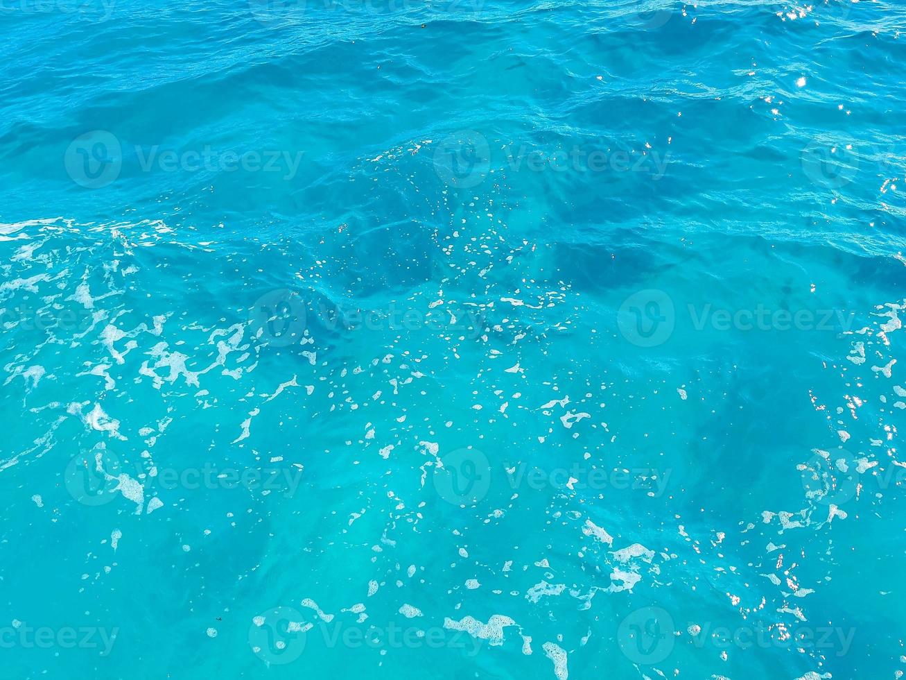 Blue turquoise water waves ocean and sea texture pattern Mexico. photo