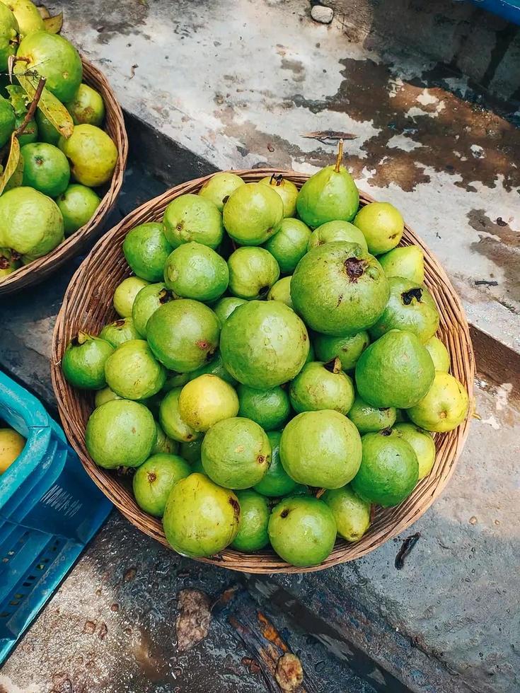 fresh green and yellow guava in the market photo