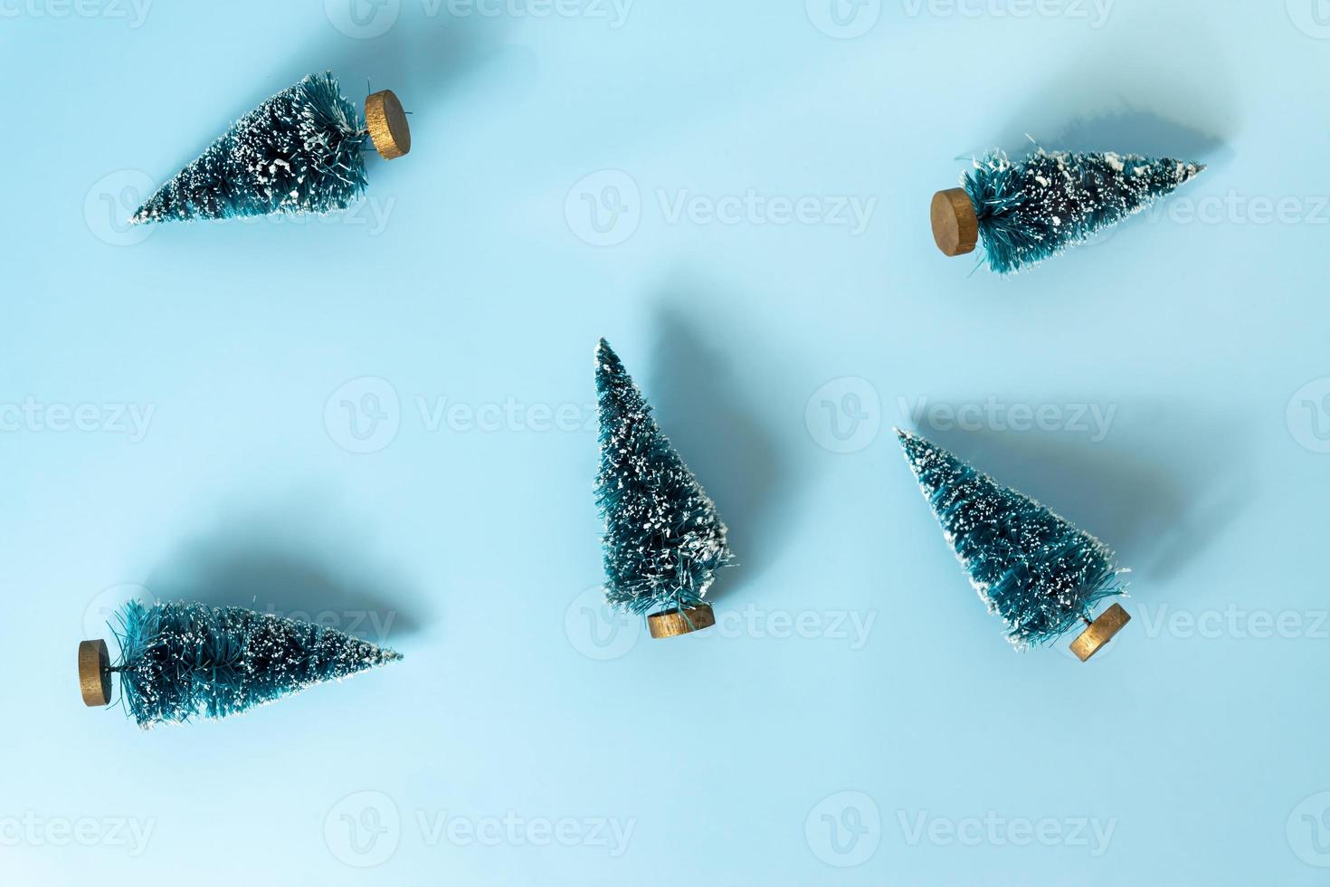 festive new year background with scattered christmas trees. Pattern design for backdrop. Minimal style. photo