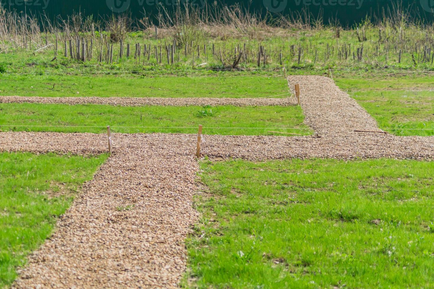 marking garden paths on the construction site. Countryside house building photo