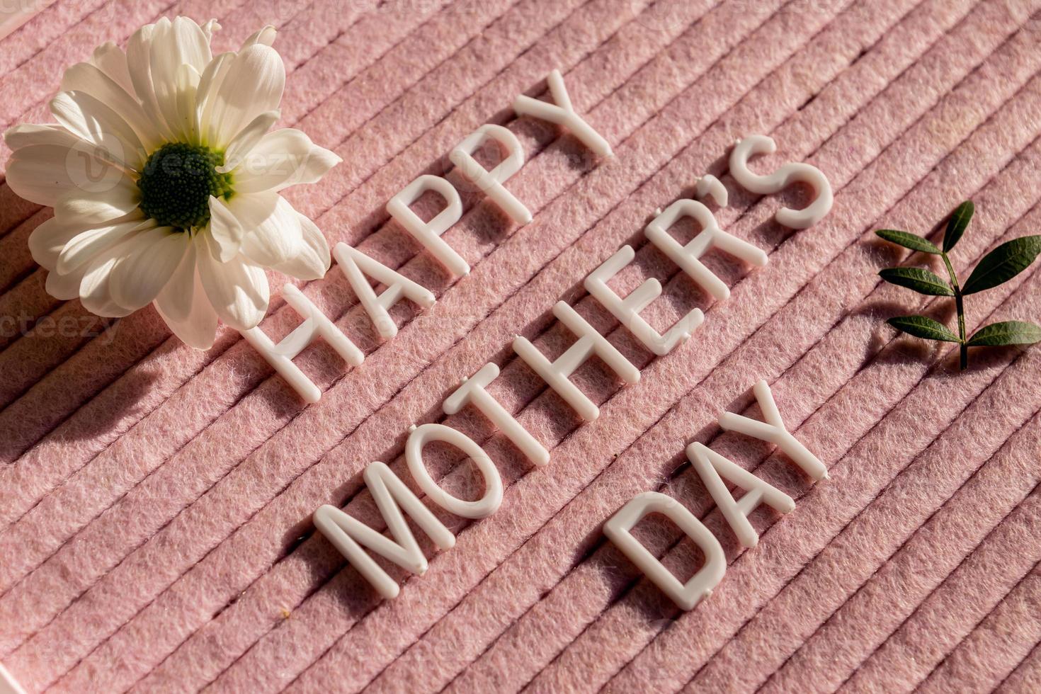 Happy Mother's Day theme with letterboard and blooming white chrysanthemum flower photo