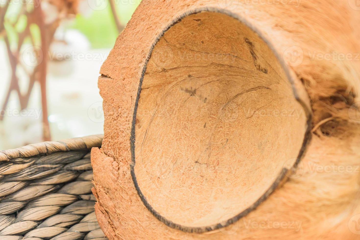 Empty coconut shell in a basket. Selective focus photo