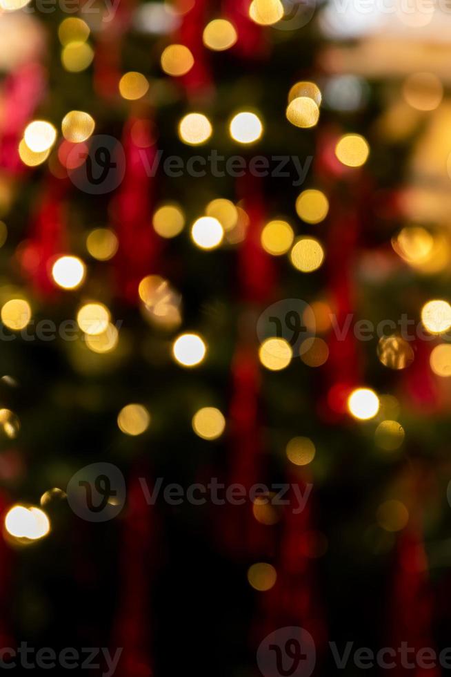 Golden glowing bokeh background. Abstract bright led light backgdrop. Defocused image photo