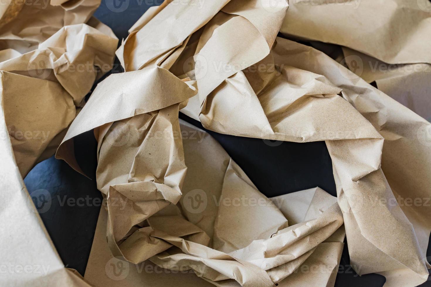 Crubpled wrapping paper for recycle. Garbage from delivery goods package. Save the planet photo