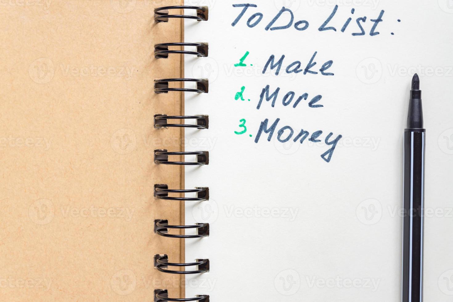 To do list - make more monTo do list - make more money written text on note pad. Close upe written text on note pad. photo