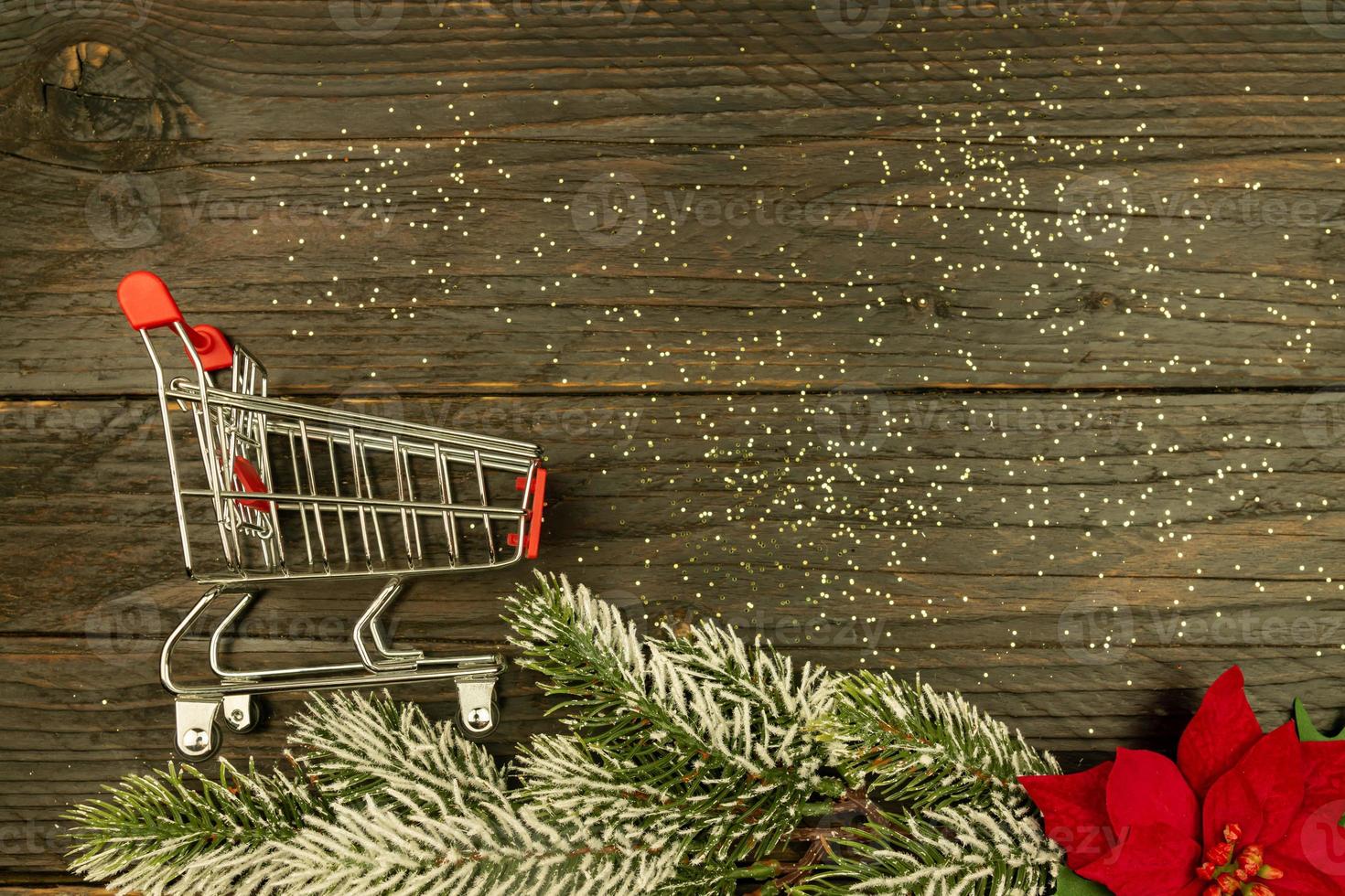 Happy New year 2021 celebration. shopping cart on wooden background. Flat lay with copy space. photo