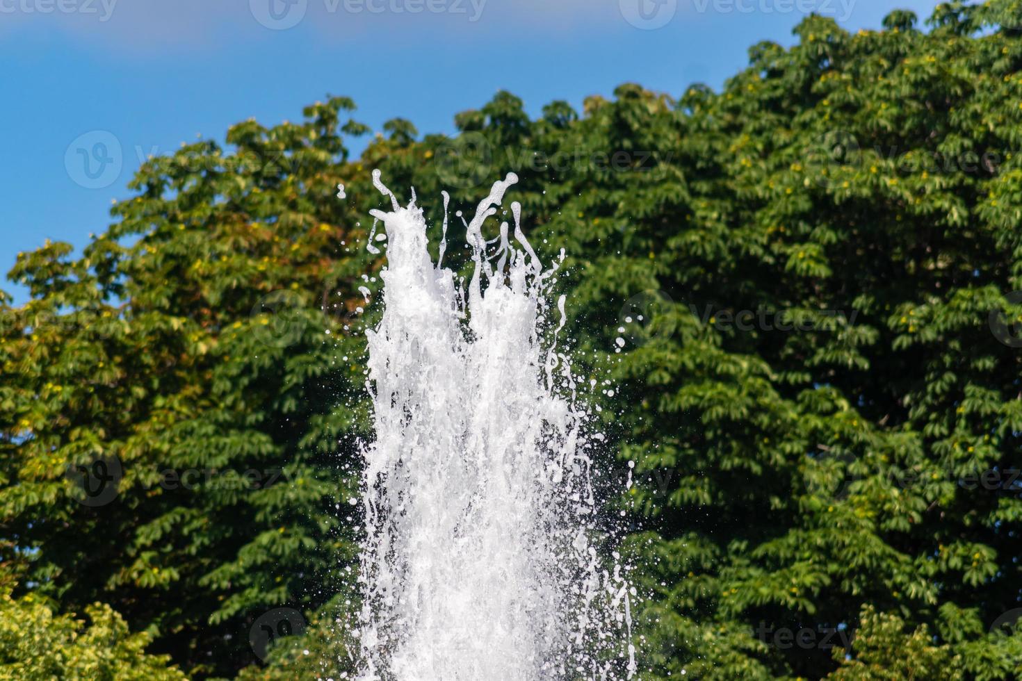 Close up of waterfall in the city pond photo