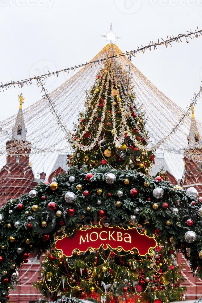 Christmas arch decorated with baubles and snow. Red signboard with word in Russian Moscow . Moscow Seasons Project photo