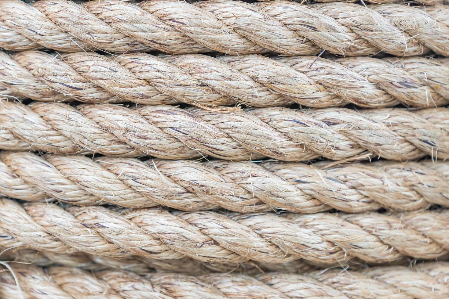 Close up view of twisted rope made of sisal. Background photo