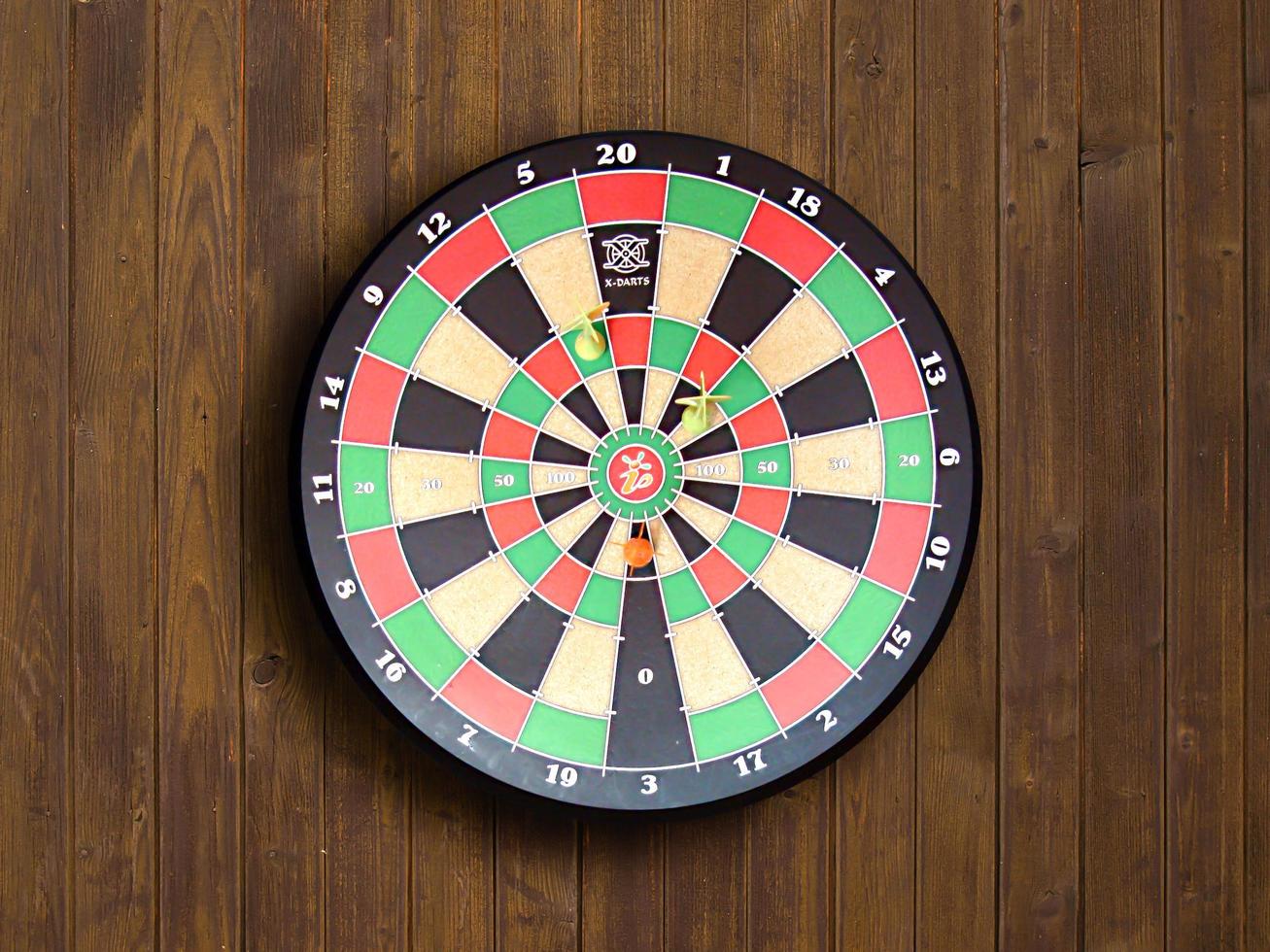 Dartboard on wood wall photo